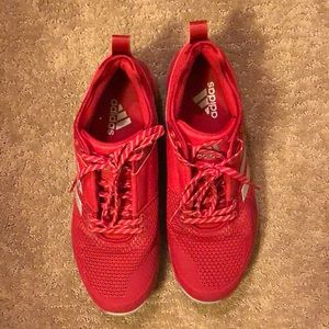 Red Adidas baseball trainer shoes